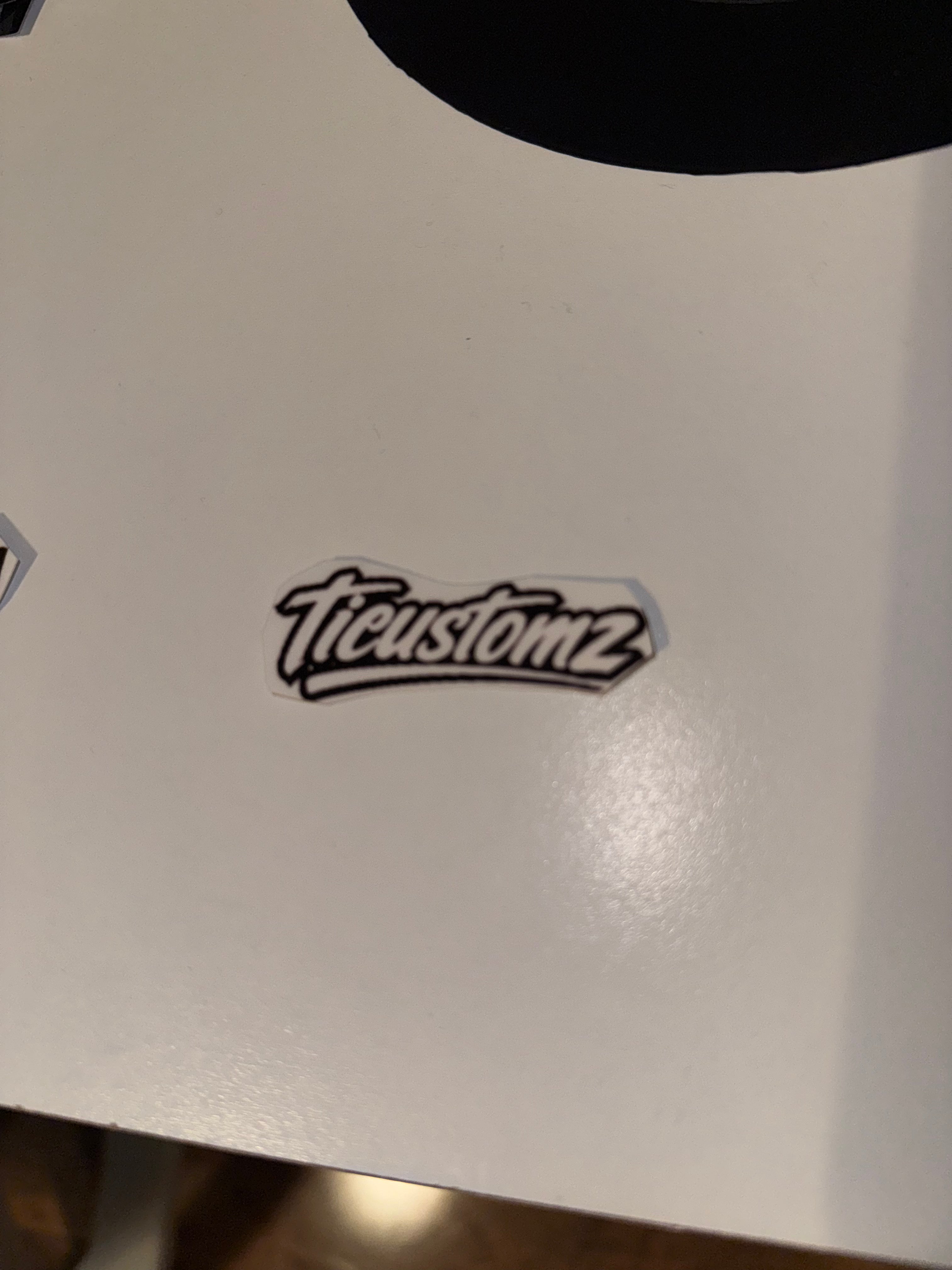 White "ticustomz" stickers